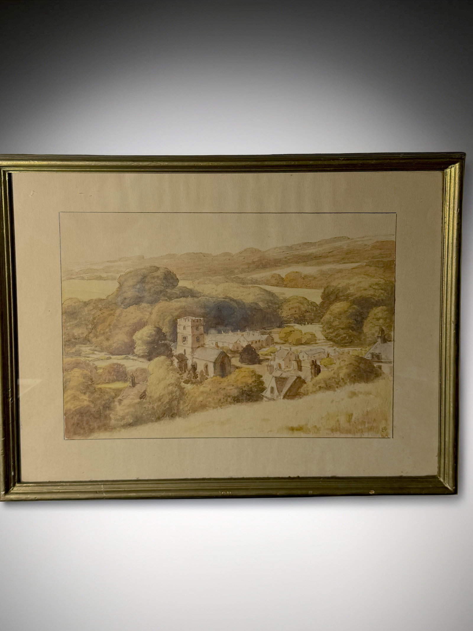 19th Century English Watercolor Landscape with Village & Church: A beautiful 19th_century English watercolor landscape depicting a serene countryside village with rolling hills, dense foliage, and a stone church tower as the focal point. Soft, earthy tones capture
