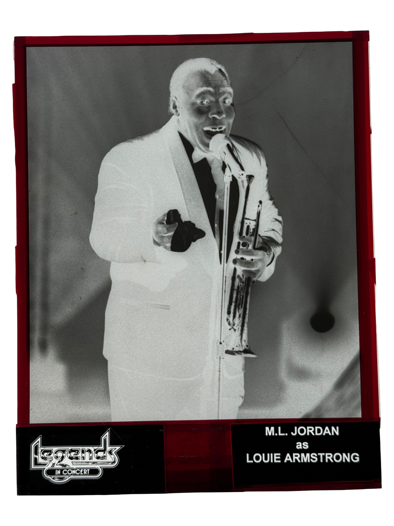 M.L. JORDAN as LOUIE ARMSTRONG Photo Negative: Framed negative photograph labeled M.L. Jordan as Louis Armstrong.