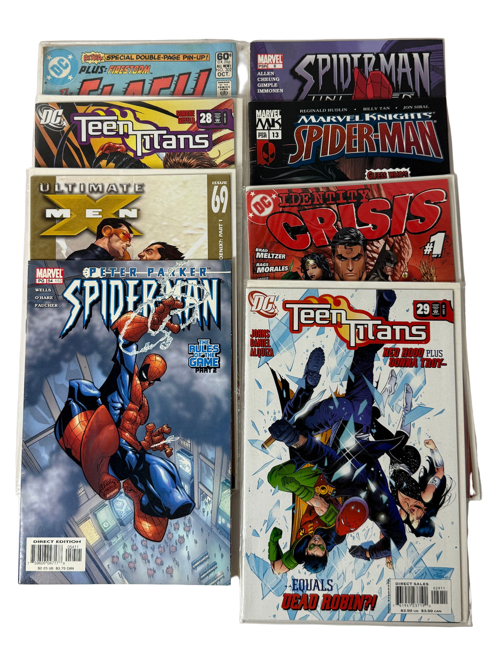 Mixed Comic Book Lot (Spider-Man, Teen Titans, Crisis): Assorted Marvel and DC comics including Spider-Man, Teen Titans, and Crisis.