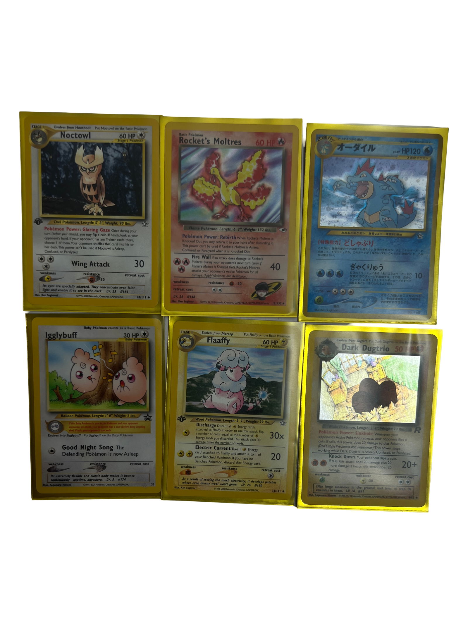 Pokemon Card Lot (Vintage): Collection of Pokemon cards including Rocket's Moltres, Totodile, Pikachu, and others.