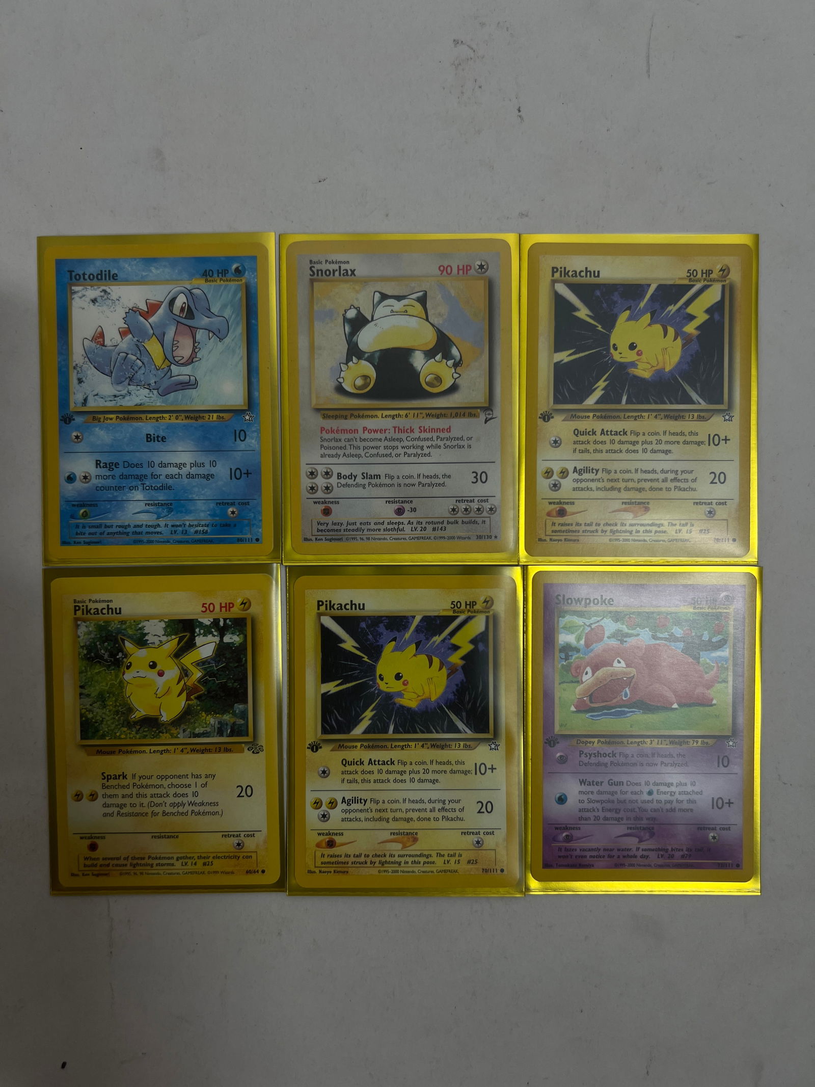 Pokemon Card Lot (Mixed): Additional set including Snorlax, Pikachu variants, Slowpoke, and Totodile.