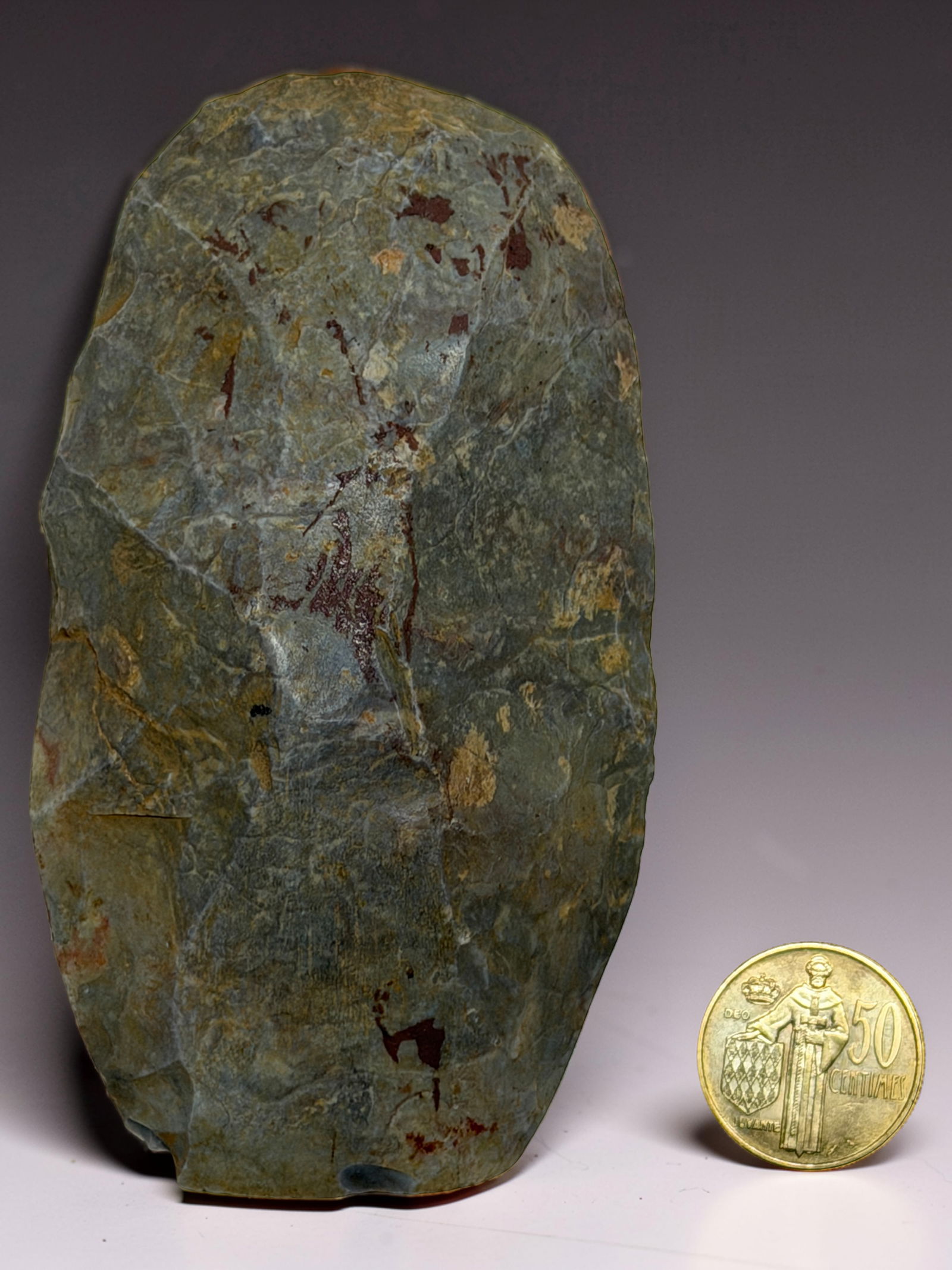 Large Stone Tool / Axe Head: Heavy stone implement with natural patina and signs of use.
