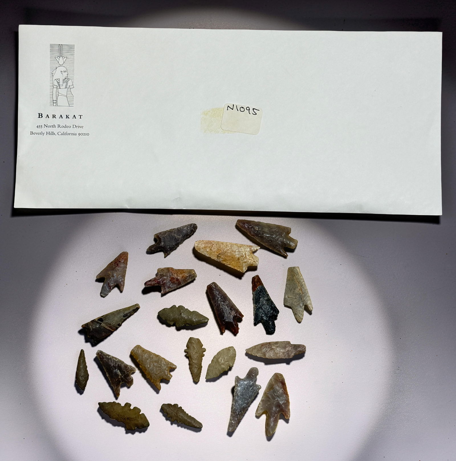 Collection of Arrowheads: Group of small stone arrowheads with Barakat envelope