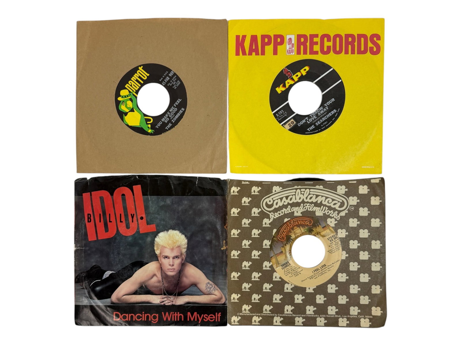 Collection of Vintage 45 RPM Records: Group of assorted 45 RPM vinyl singles including Billy Idol and other artists.