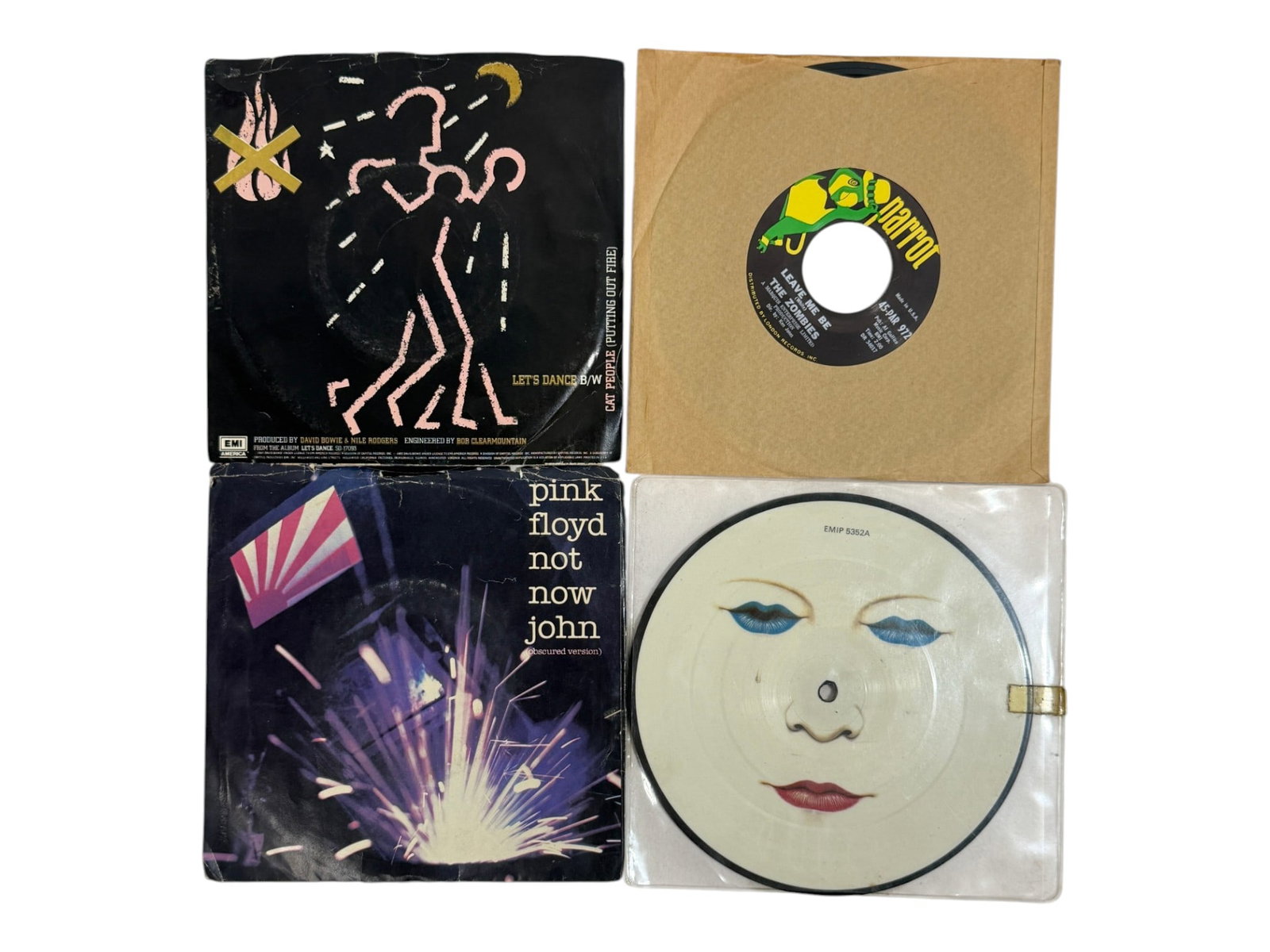 Rock and Pop 45 RPM Record Lot: Assortment of collectible vinyl singles including David Bowie, Pink Floyd and other performers.