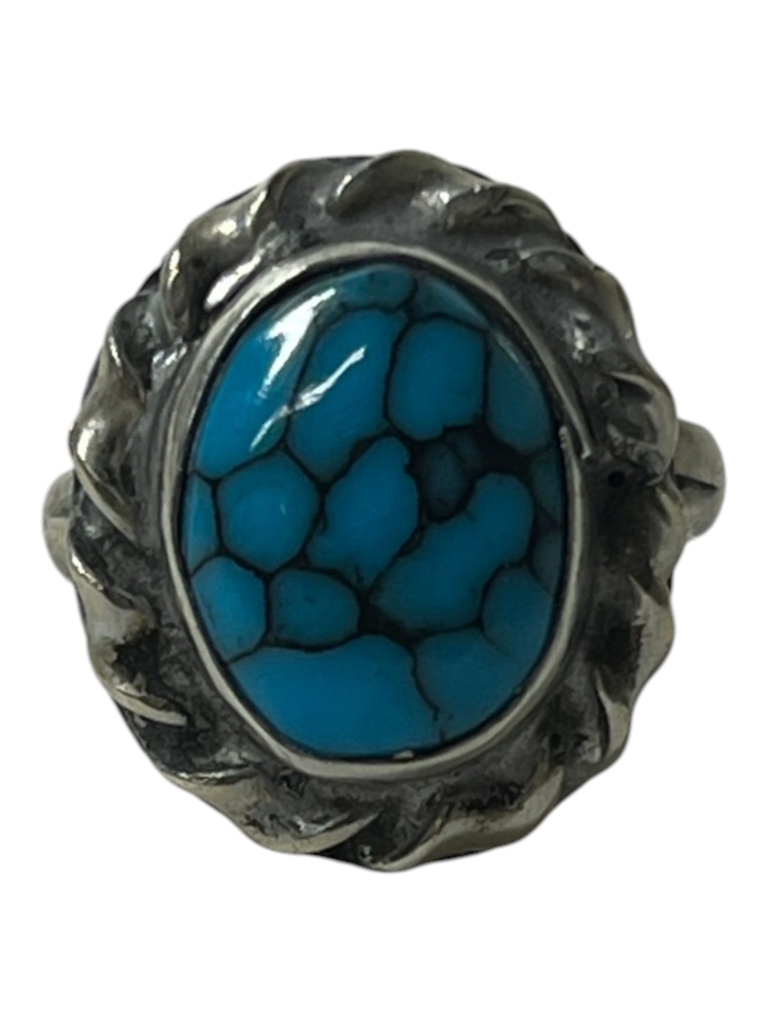 Sterling Style Turquoise Ring: Decorative ring set with a turquoise-colored stone in ornate mount.