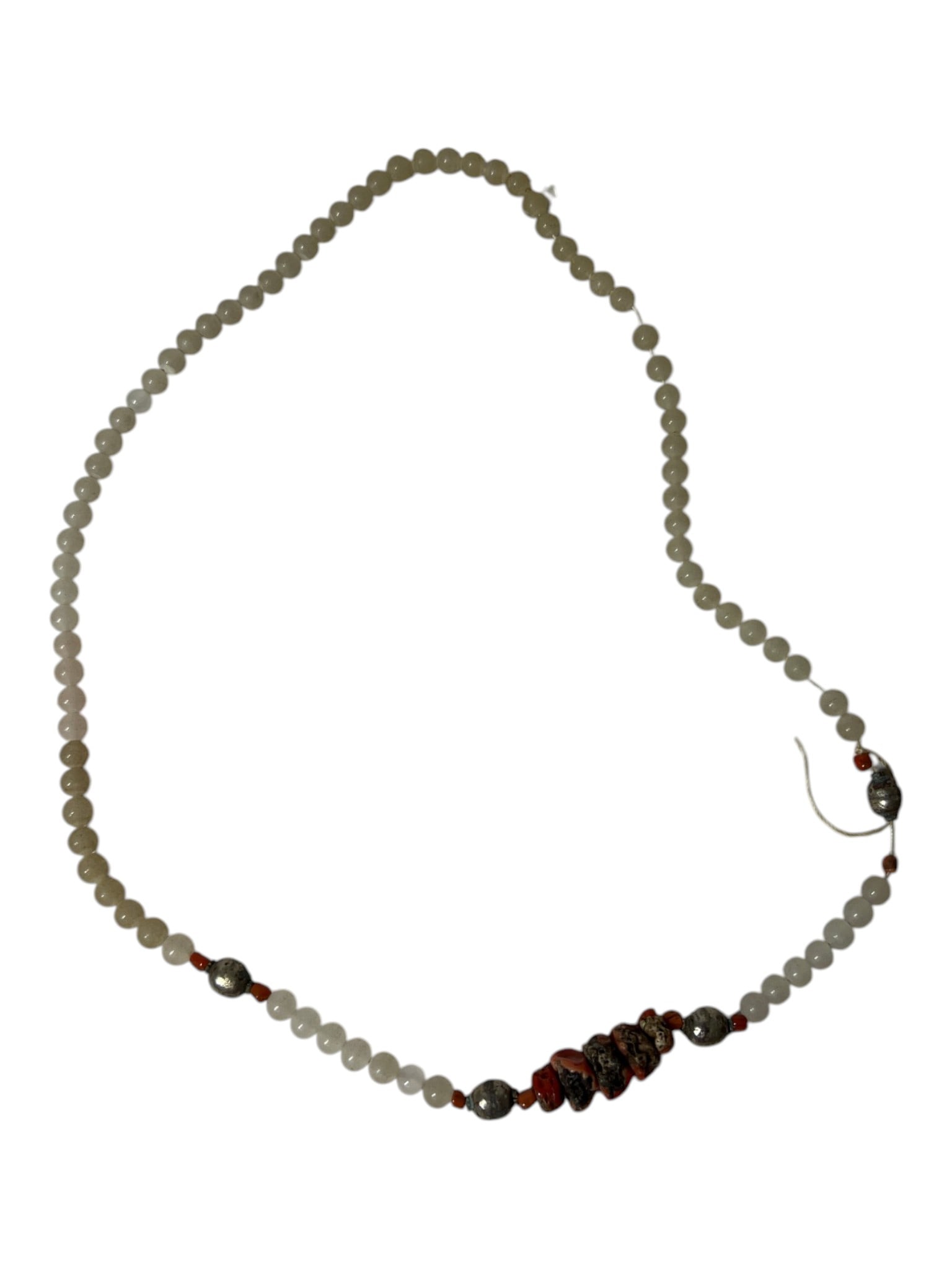 Stone Bead Necklace: Strand of pale stone beads with metal and red stone accents.