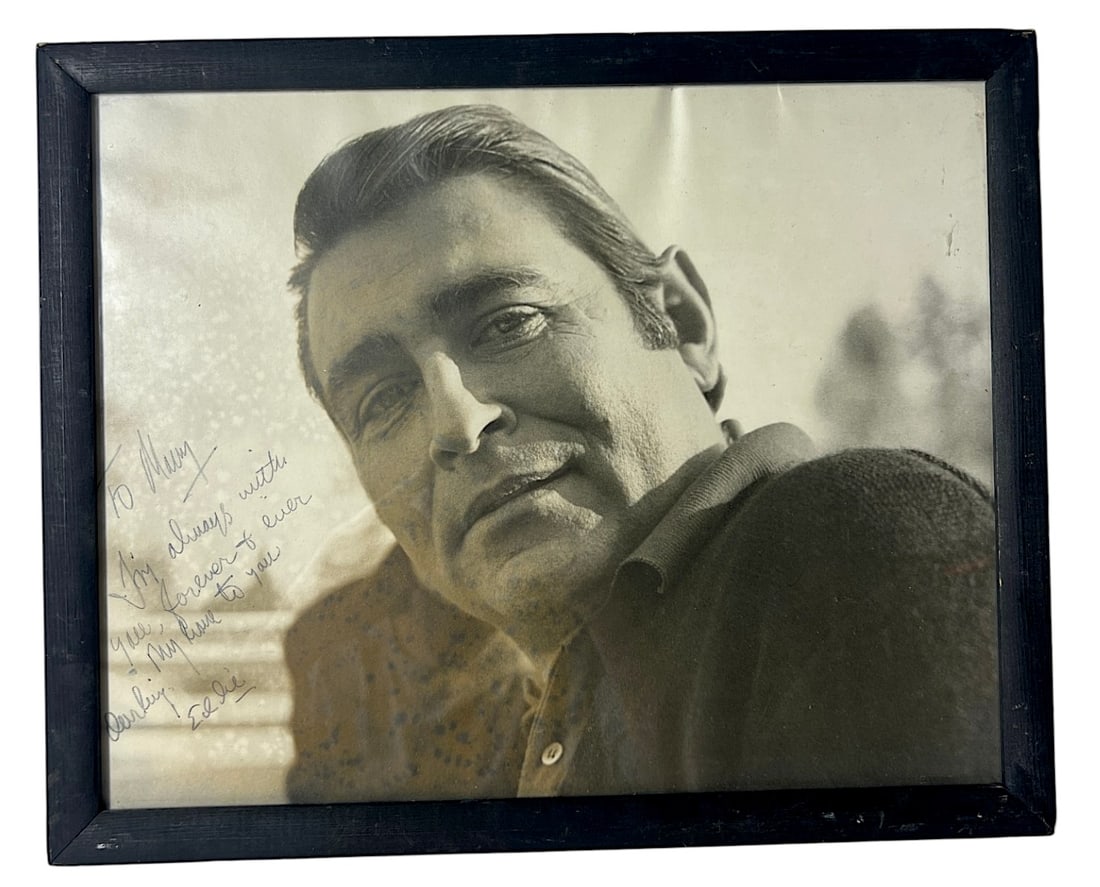 Framed Inscribed Male Portrait Photograph: Vintage framed black-and-white portrait photograph of a male performer/actor, inscribed to "Nell" and signed "Eddie". Good decorative/entertainment collectible, with age toning and frame wear.