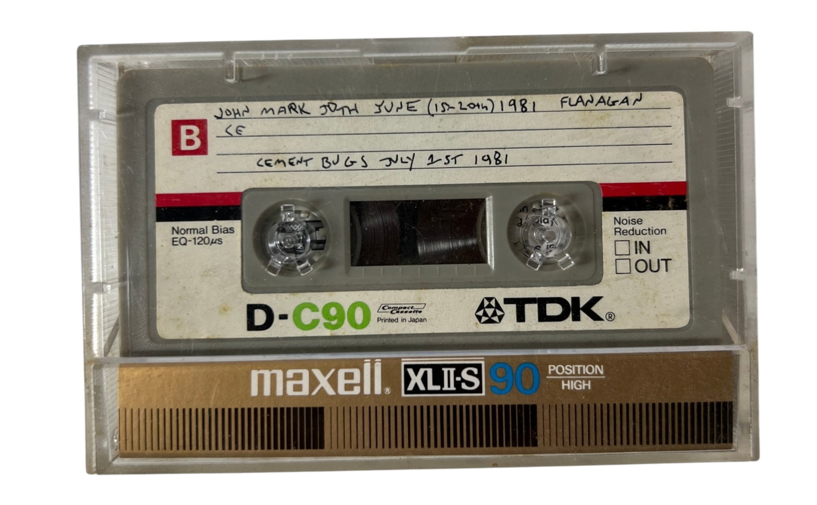 Cement Bugs 1981 Punk Rock Archive Cassette: Vintage recorded cassette with handwritten label reading ?Cement Bugs July 21st 1981? and additional notation including ?John Mark ... June (15-20th) 1981 Flanagan.? TDK D-C90 tape in Maxell case. An 