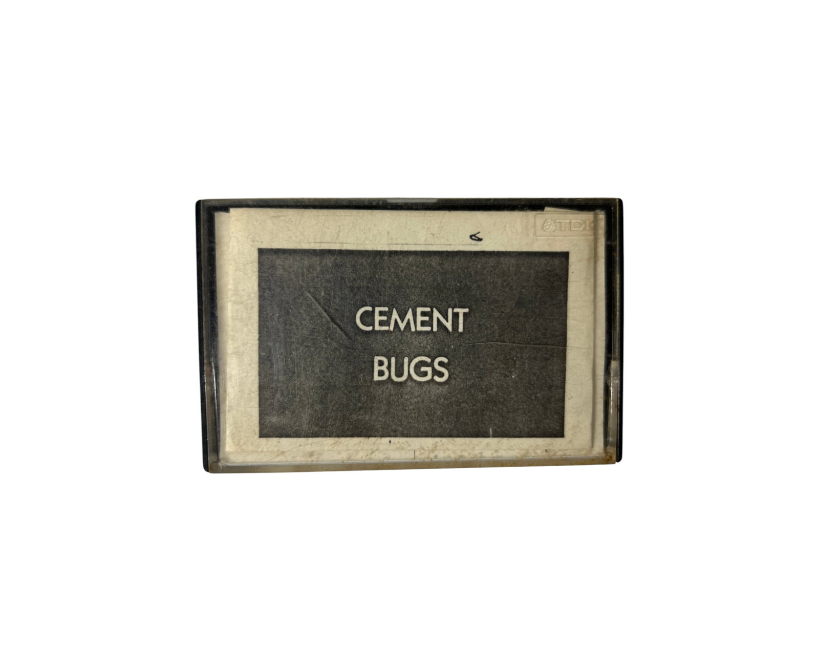 Cement Bugs Demo Vintage Punk Rock Cassette Tape: Vintage cassette tape labeled CEMENT BUGS in period case. Original underground punk rock archive material. Untested; case and tape show age and storage wear.