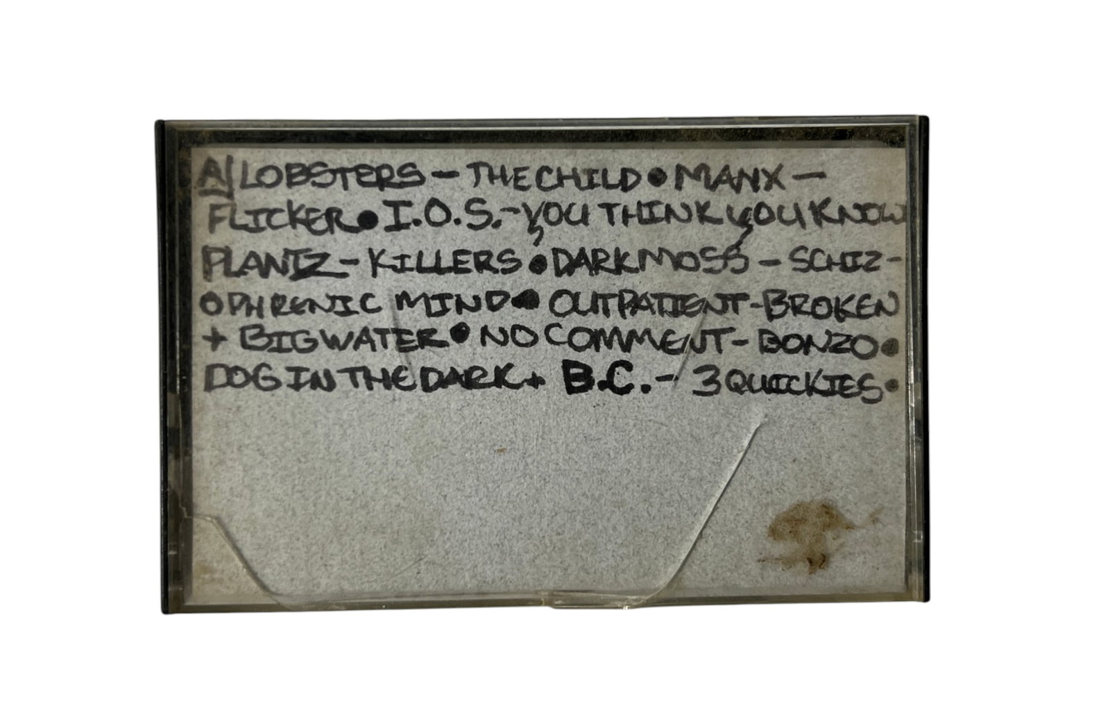 1980s Punk Rock Compilation Cassette Archive: Vintage cassette case with handwritten band list including The Lobsters, The Child, Manx, Flicker, I.O.S., Plan Z, Killers, Darkness, Schizophrenic Mind, Outpatient, Broken, Big Water, No Comment, Bon