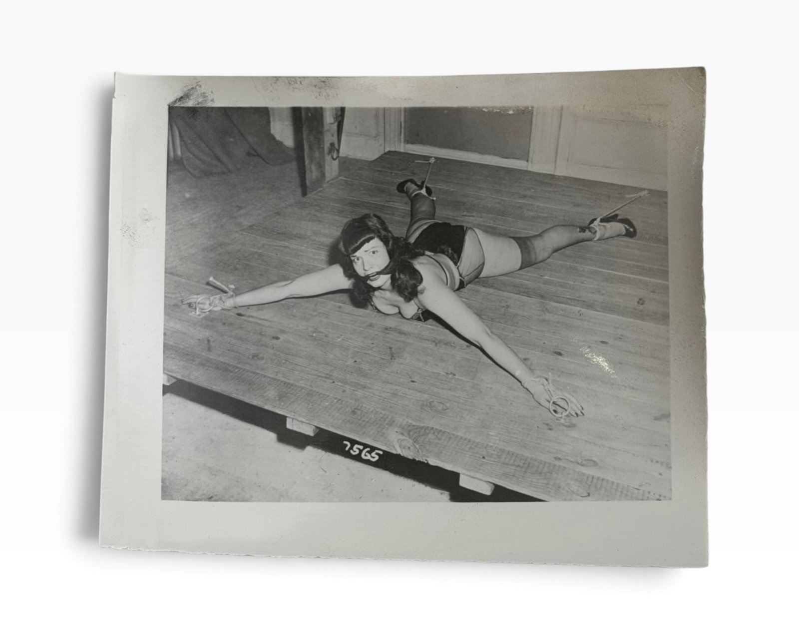 Vintage BlackandWhite Adult Bettie Page Photograph No 7565: Original vintage black-and-white glossy photograph depicting a staged . Image bears production/reference number 7565.