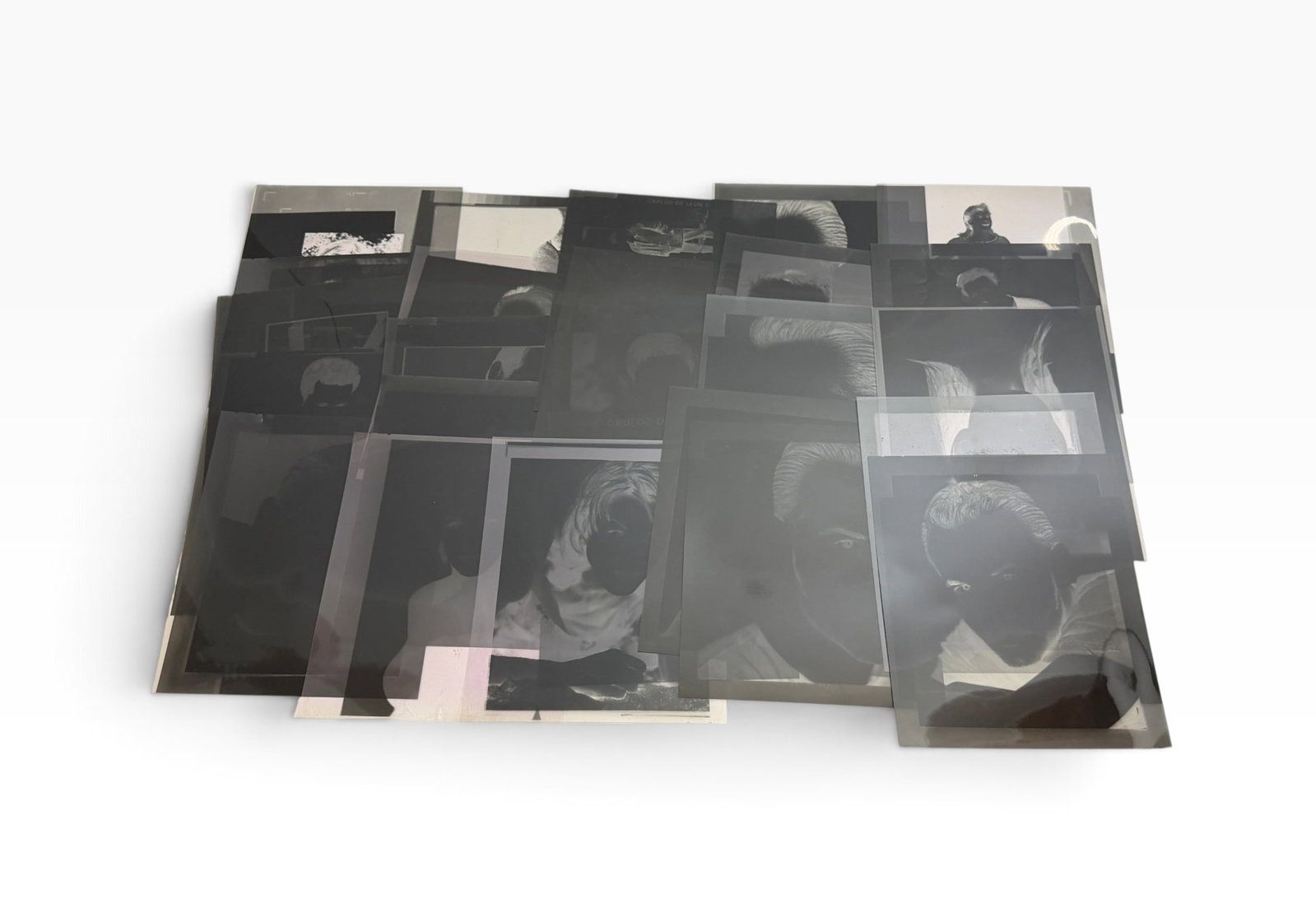 Large Group of Vintage Celebrity Portrait Photo Negatives: Large archival lot of vintage photographic negatives and transparencies dominated by studio-style and editorial portrait imagery. Mixed sizes and formats with numerous individual headshots and posed p