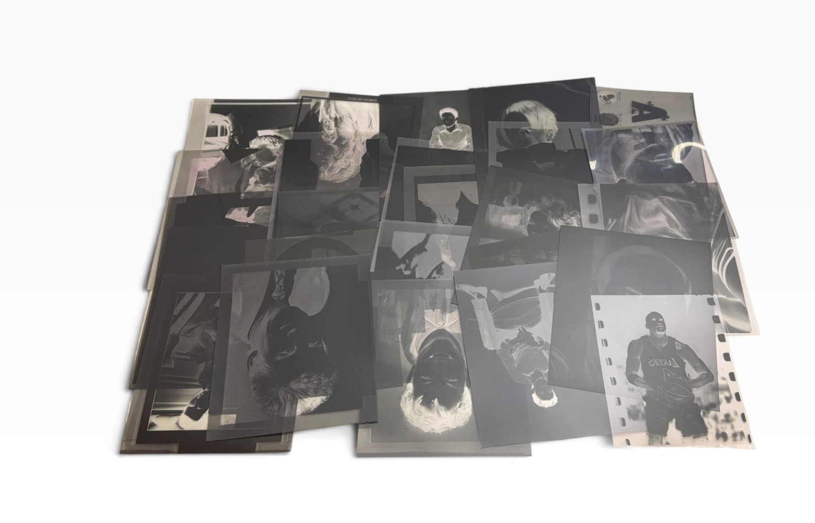 Large Group of Vintage Celebrity Celebrity Sports Music And Movie Fashion Photo Negatives: Large assortment of vintage photographic negatives and transparencies featuring celebrity, fashion and portrait imagery. Includes studio portraits, headshots and editorial subjects in mixed sizes and 