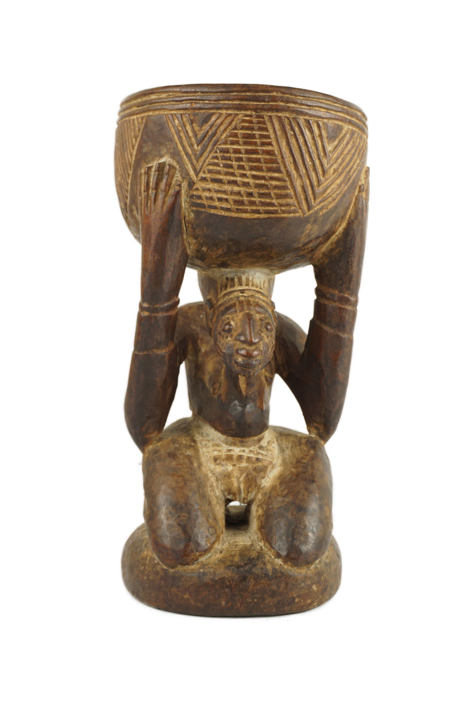 Yoruba Offering Bowl Figure: Early to Mid 20th Century. An amazing piece with a beautiful patina that shows evidence of tribal use. This is from the Yoruba people of Nigeria. The patina has been tested. Has a crack in the wood