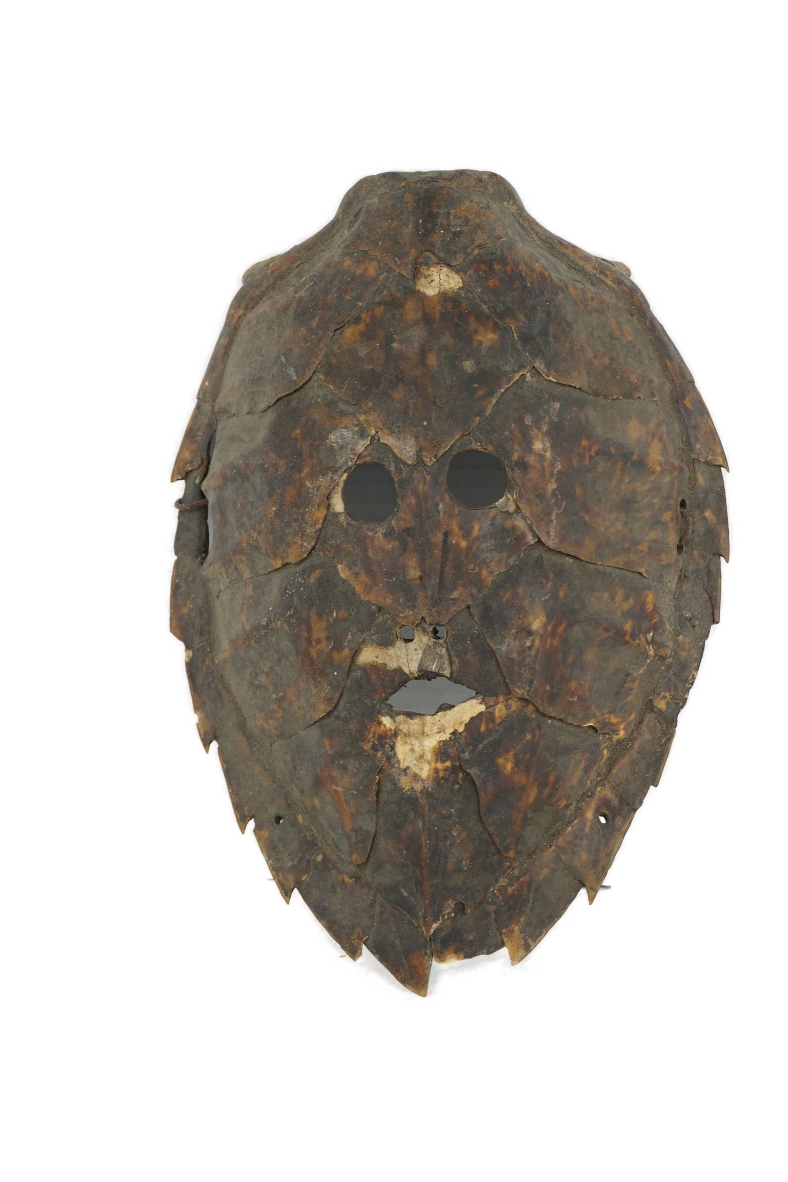 Torres Strait Turtle Shell Masks: Mid 20th Century, Masks crafted from turtle shell are most famously associated with the Torres Strait Islands (located between Australia and New Guinea). These unique, highly complex ceremonial