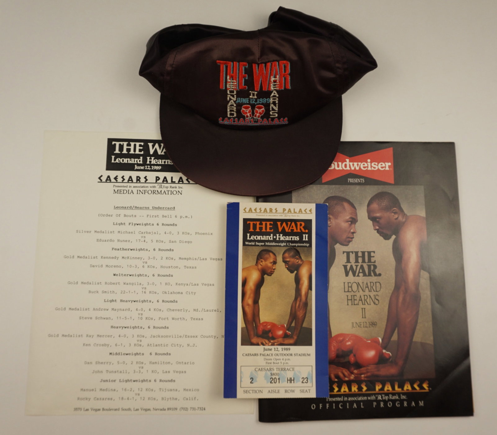1989 Leonard vs Hearns II “The War?? Caesars Palace Boxing Program, Ticket & Hat Lot: SHIPPING NOTE: We have in house shipping and can do fairly cheap rates, and I am more than happy to combine shipping. I can often do better than the Live Auctioneers shipping quote, so bid away! Feel 