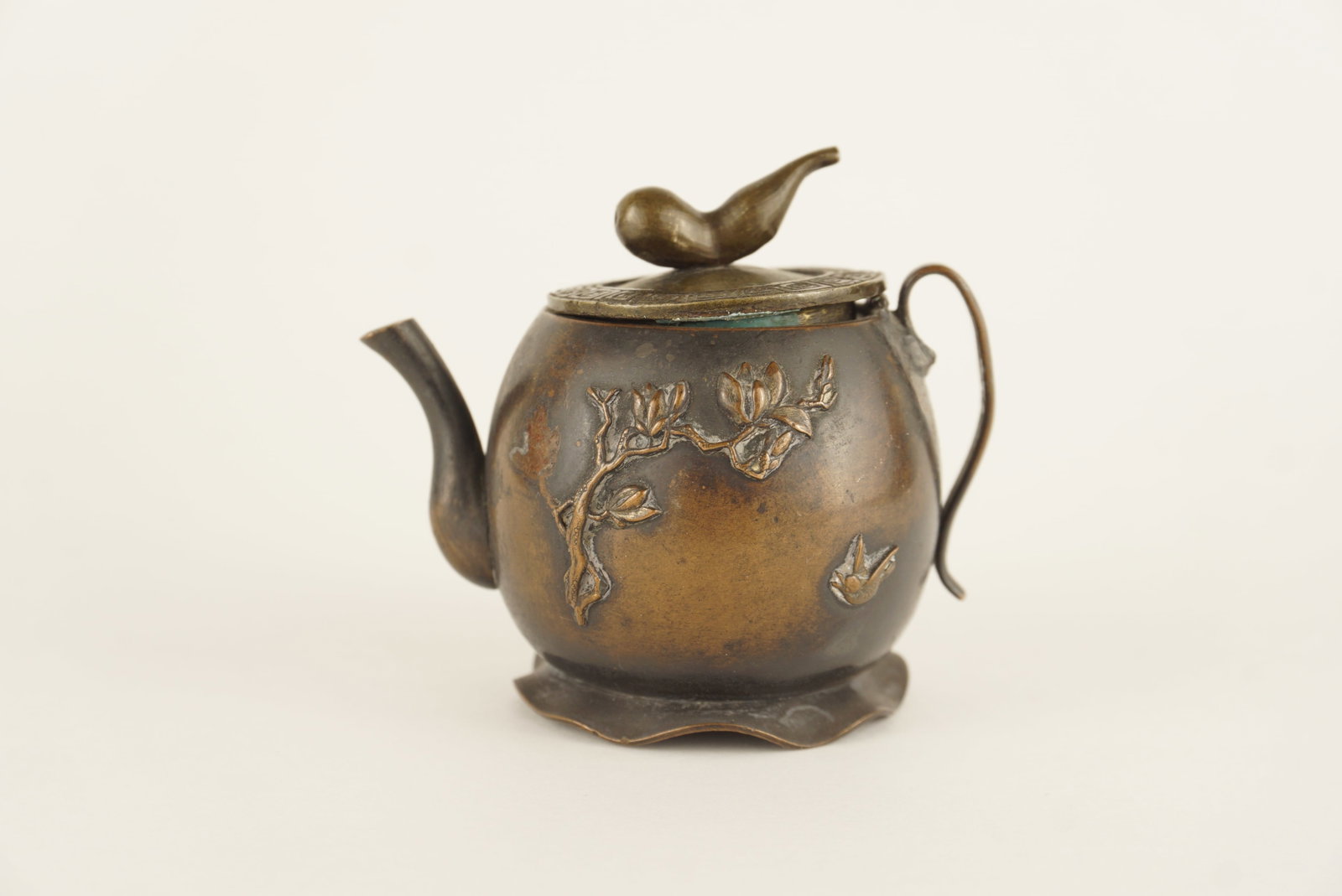 Antique Chinese Cast Bronze Teapot with Raised Floral & Bird Motif: SHIPPING NOTE: We have in house shipping and can do fairly cheap rates, and I am more than happy to combine shipping. I can often do better than the Live Auctioneers shipping quote, so bid away! Feel 