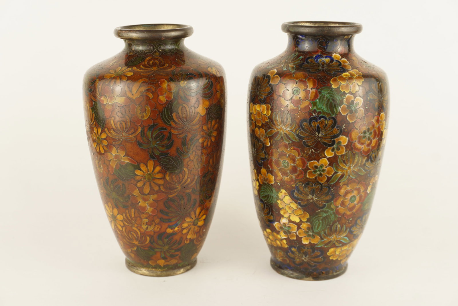 Pair of Meiji Japanese Cloisonne Enameled Brass Floral Vases: 6.5” x 3.5” per vase. SHIPPING NOTE: We have in house shipping and can do fairly cheap rates, and I am more than happy to combine shipping. I can often do better than the Live Auctioneers 