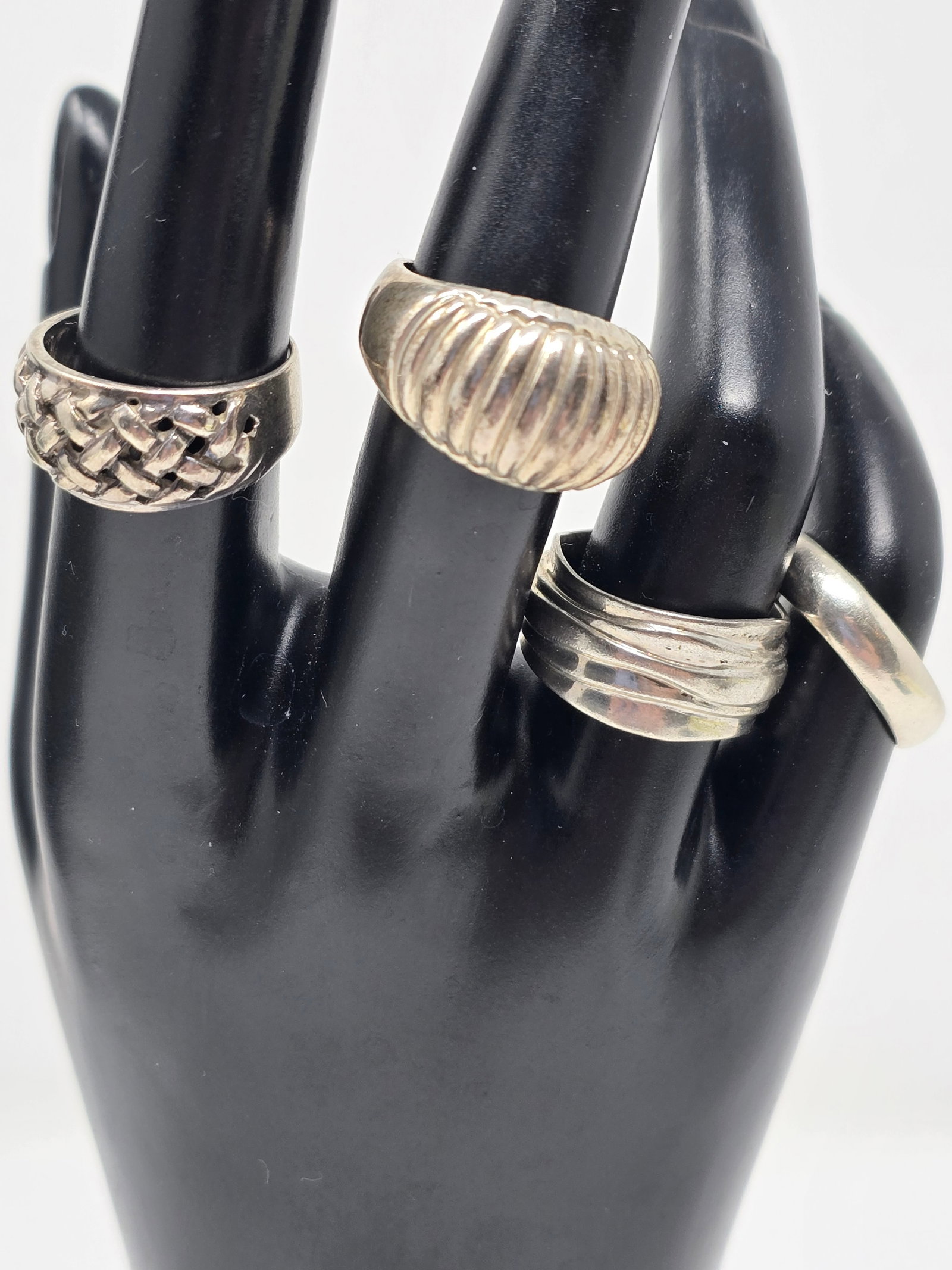 4 - Signed 925 Sterling Silver Rings: 4 - Signed 925 Sterling Silver Rings Woven, Wave, Scalloped Dome and Simple Band Approx. Size 8 22.35 Maker's Marks: "MK, R with half moon, SU & Unknown"