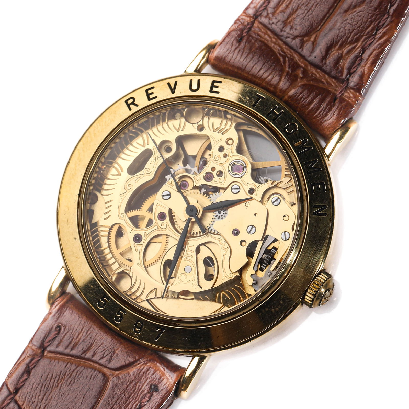 REVUE THOMMEN SKELETONIZED GOLD-TONE MANUAL-WIND WRISTWATCH: Dimensions Case diameter: 1 23/64 in. (34.4 mm); overall length approx. 9 1/4 in. (23.5 cm). Description A Revue Thommen skeletonized wristwatch, showcasing an openworked dial that fully reveals the