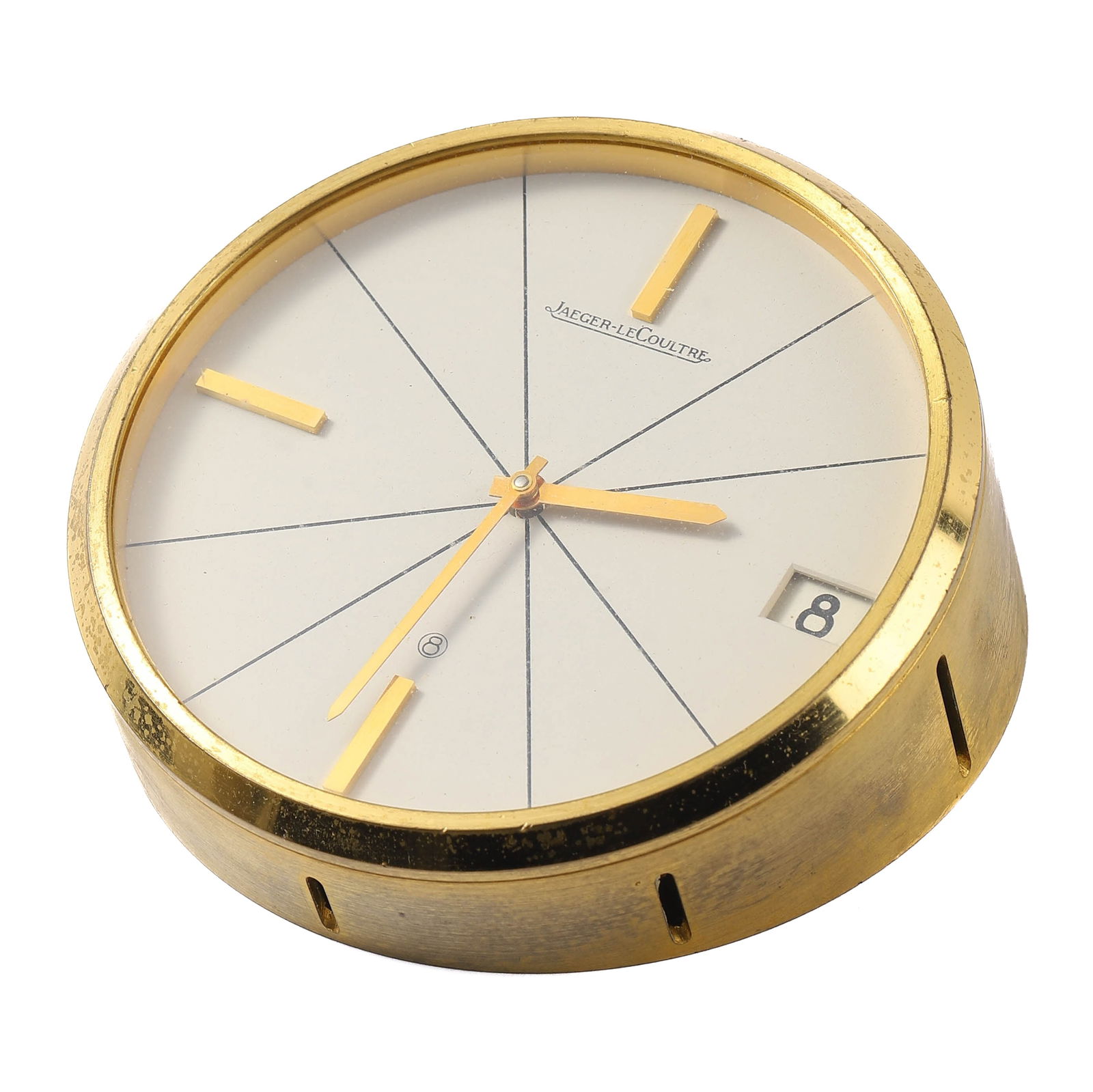 JAEGER-LECOULTRE SWISS MADE DESKTOP CLOCK: diameter: 3 13/16 in (9.7 cm) A classic desktop clock by the renowned Swiss watchmaker Jaeger-LeCoultre. This piece features a minimalist design with a radiant line motif on the cream-colored dial,