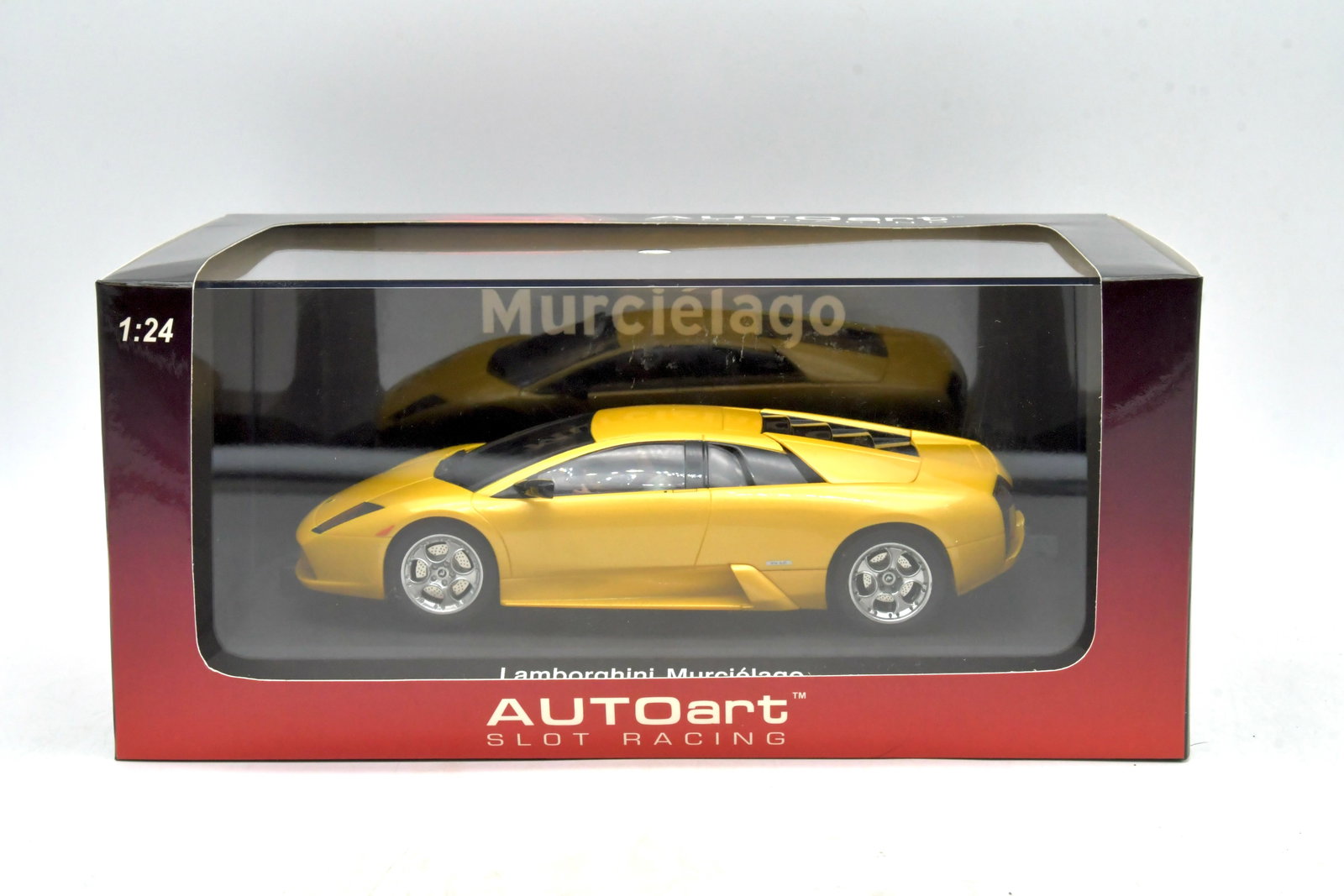 AUTOart Slot Racing Lamborghini Murciélago 1/24: AUTOart Slot Racing Lamborghini Murciélago factorybuilt 1:24 scale slot car. Detailed licensed Murciélago body finished in yellow, mounted on a 1/24 slotracing chassis, designed for standard