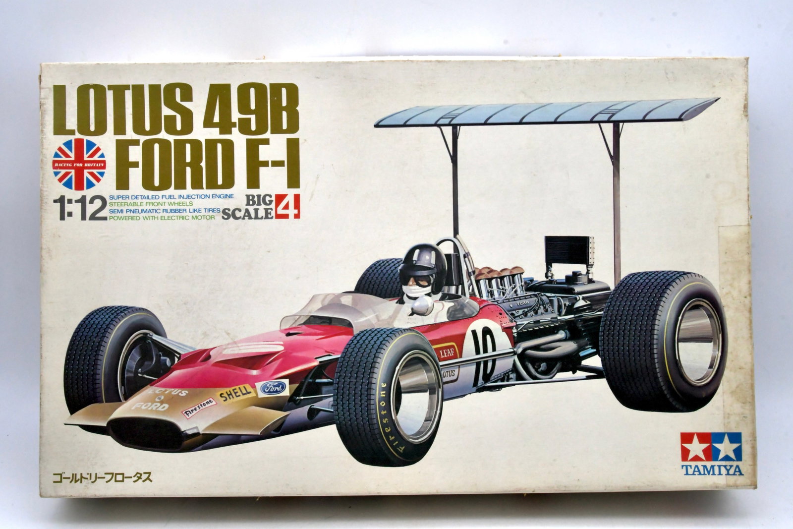 Tamiya Lotus 49B Ford F1 1/12 Big Scale Motorized: Tamiya 1/12 scale Lotus 49B Ford Formula One plastic model kit from the Big Scale Series No.4. Classic largescale F1 release with detailed DFV engine parts, steerable front wheels, rubber tires, and e