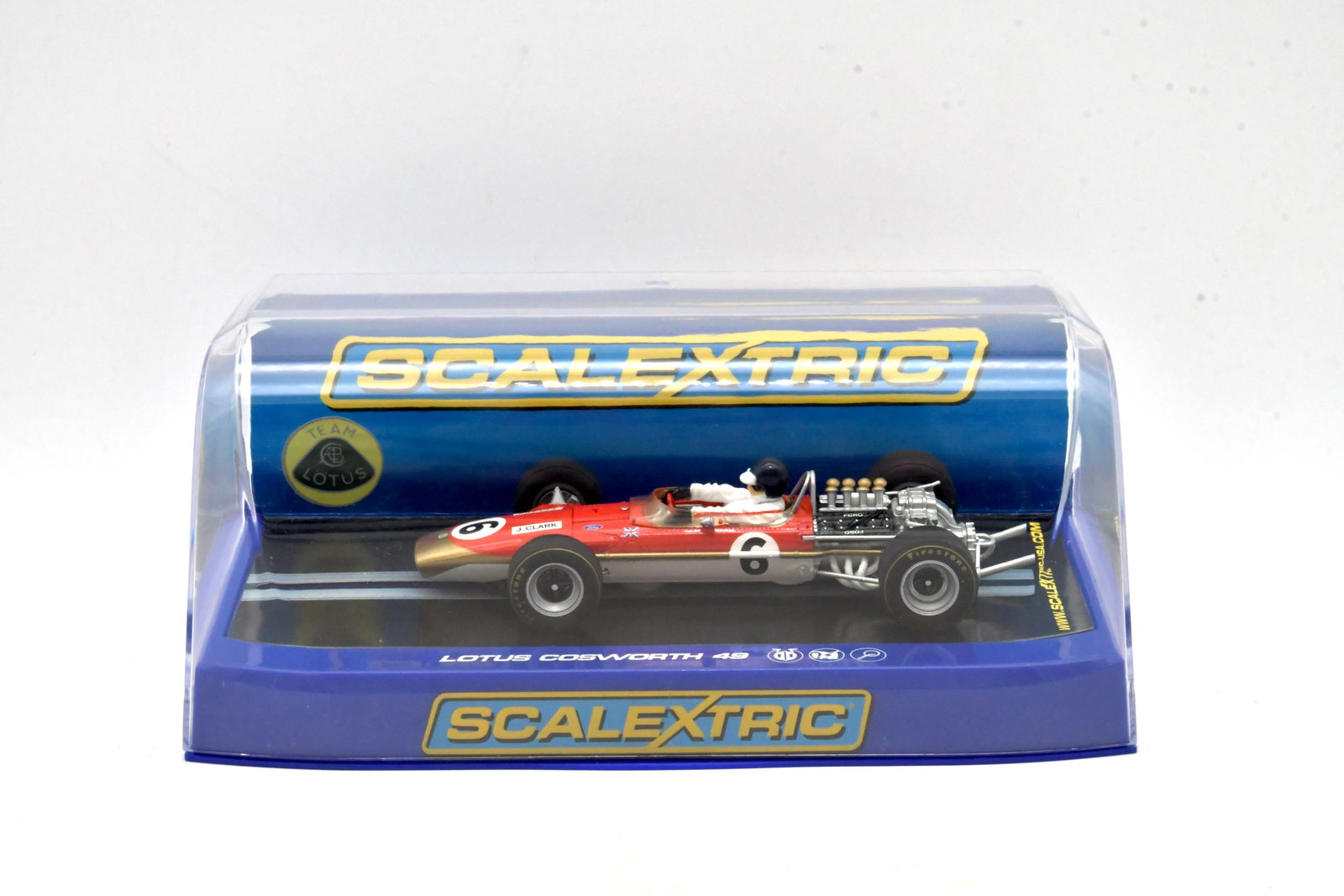 Scalextric Team Lotus 49 Jim Clark No.6 Slot Car: Scalextric Team Lotus 49 Formula One slot car featuring Jim Clark No.6 livery. Displayed in original clear Scalextric presentation case with blue base.