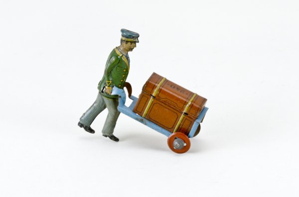 German Bell Hop with Luggage Penny Toy: Lithographed and marked "240" on top of trunk.