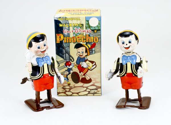 Linemar Mechanical Pinocchio Toy in Box: Marked "Walt Disney Productions". Two tin wind-up toys, one box.
