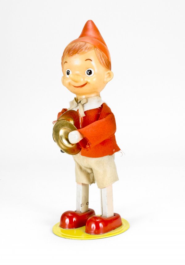 Wind-up Mechanical Pinocchio Toy: Fabric clothing, marked "Made in Japan". Works well.