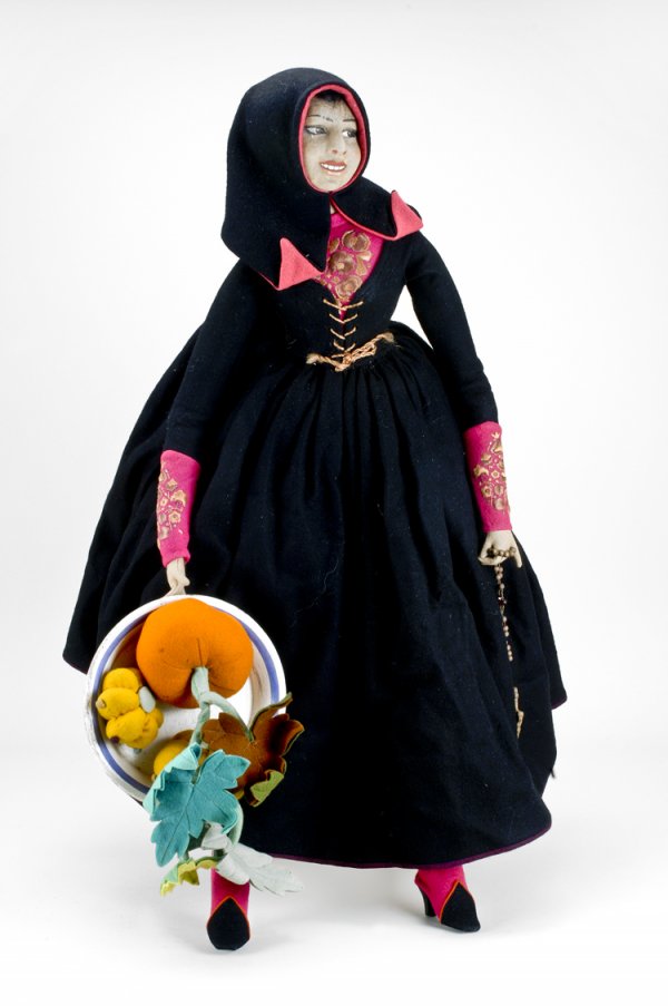 Large Early Lenci Doll: Rare 28" tall doll. 1920's with painted features, brown mohair wig, all original felt clothing with original bowl of felt fruit and rosary. Original Lenci paper tag sewn to inside of skirt dated 1921.