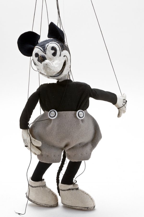 Rare Early Tony Sarg Mickey Mouse Marionette: Circa 1933, paper mache head, painted features, pie eyed, felt ears, cloth body and clothing. T. Sarg and Company, New York City label on the bottom of foot. Tony Sarg (1882-1942), highly respected fo