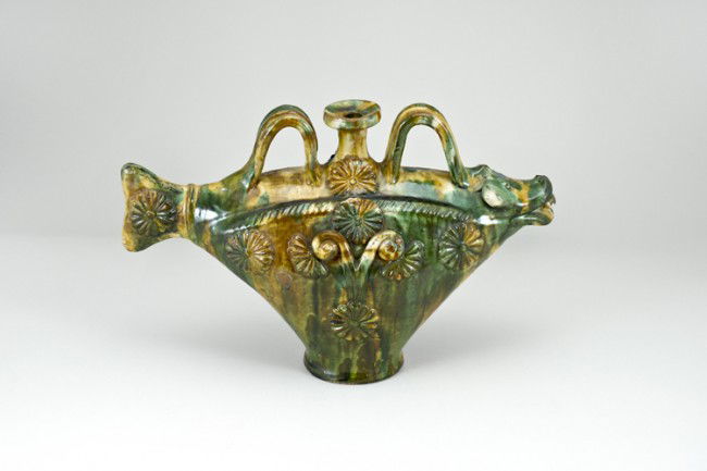 Figural Redware Jug: 9 1/2" tall x 15 1/2" wide, animal head, fish tale and floral decorated with tri-color glaze. Age and origin unknown.