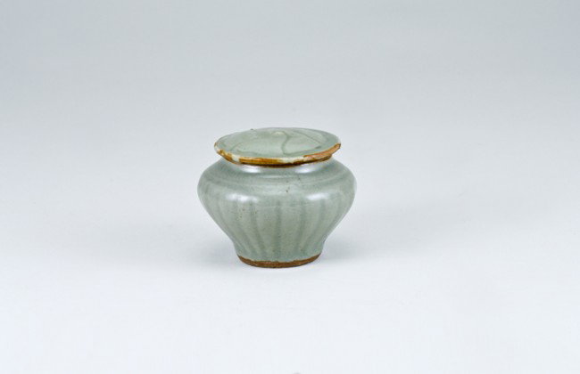 Ancient Chinese Celadon Covered Potiche: 2 3/8" tall overall with 2" top opening. Labeled as: Circa 13th-14th Century Longquan. From a collection of Chinese Sung, Tang and Han Dynasty pottery, all originating from the construction site of th