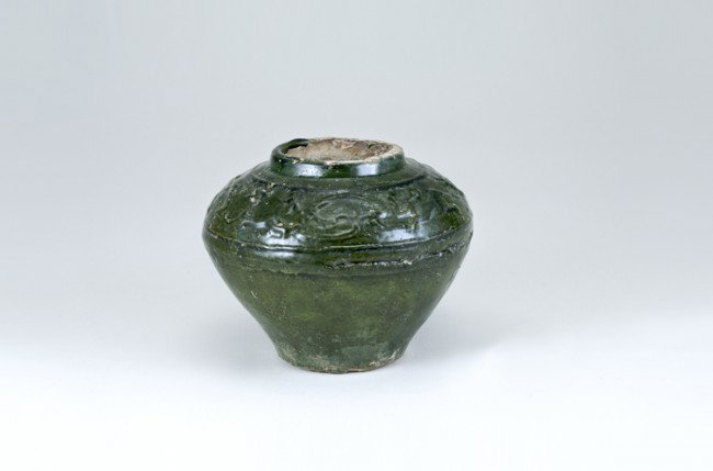 Ancient Chinese Han Dynasty Jar: Top opening is 3", base diameter 3", 4 3/4" tall. Labeled as: Circa 206 BC-220 AD. Embossed decoration. From a collection of Chinese Sung, Tang and Han Dynasty pottery, all originating from the constr