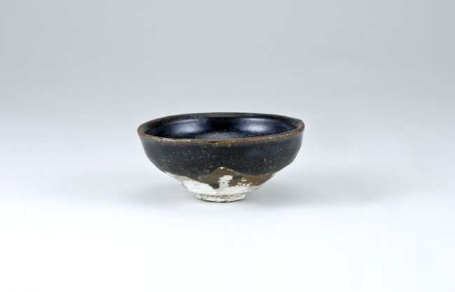 Ancient Chinese Bowl: Top diameter 4", base diameter 1 1/4". Labeled as: Sung Dynasty Temmoku Bowl with Encrustations. From a collection of Chinese Sung, Tang and Han Dynasty pottery, all originating from the construction 