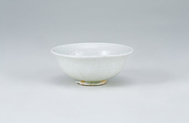 Ancient Chinese Bowl: Top diameter 3 1/2", base diameter 1 1/4". Labeled as: Ching-Pai, Small Bowl with Flared Rim, Southern Sung Dynasty, 12th Century. From a collection of Chinese Sung, Tang and Han Dynasty pottery, all 