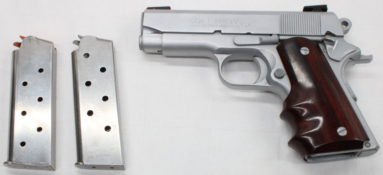 Colt MK IV Series 80 Officer's ACP .45 ACP Semi-Automatic Pistol, S/N FA23191, w/ Box & (2): Colt MK IV Series 80 Officer's ACP semi-automatic pistol chambered in .45 ACP. Blued finish with compact barrel configuration, fiber optic front sight, and custom grips. Includes two magazines and ori