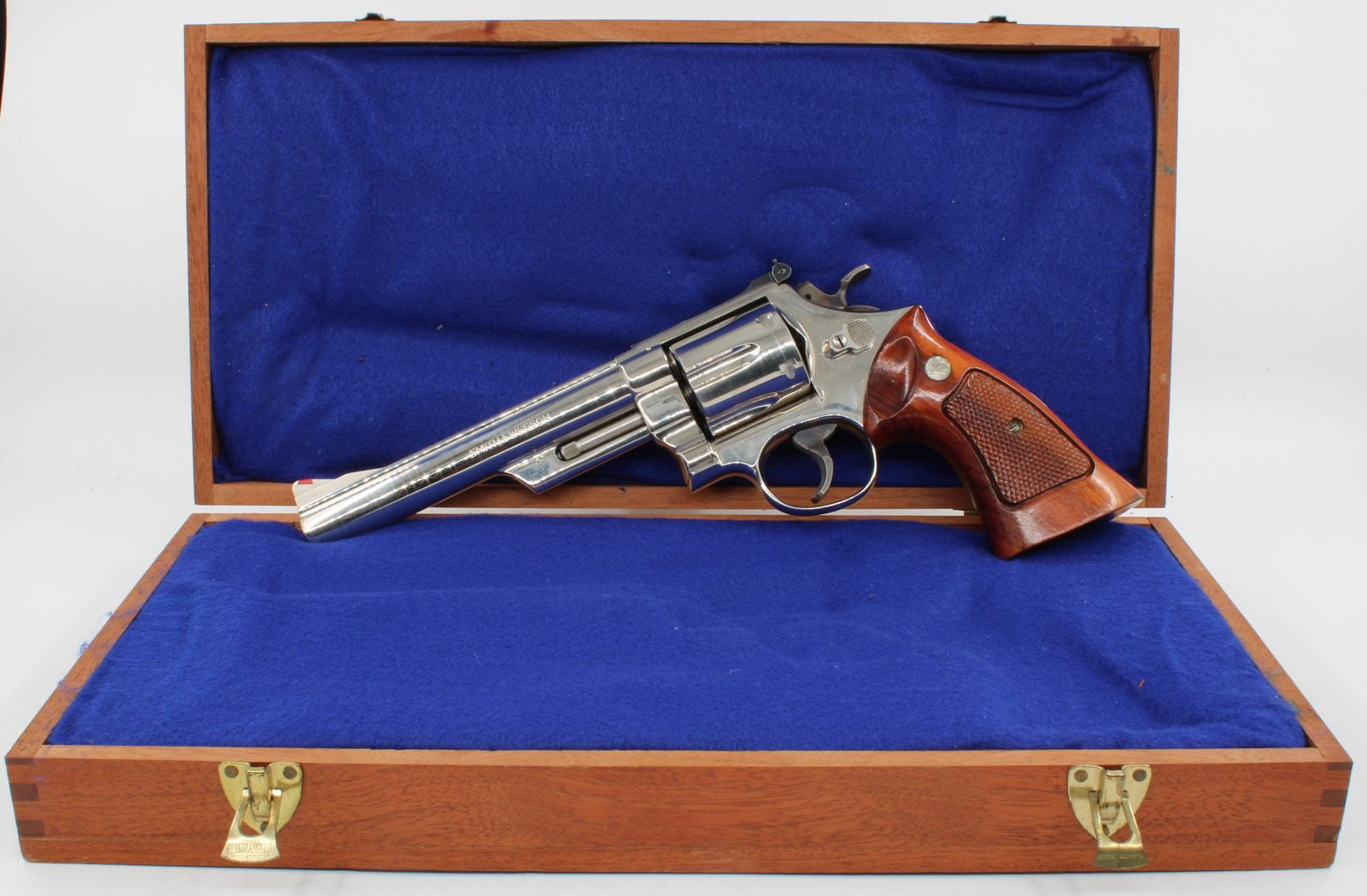 Smith & Wesson Model 29 .44 Magnum Nickel Double Action Revolver, S/N N359843, w/ Cherry: Smith & Wesson Model 29 double action revolver chambered in .44 Magnum. Nickel finish with pinned barrel, recessed cylinder, and checkered walnut target grips. Includes fitted cherry wood presentation