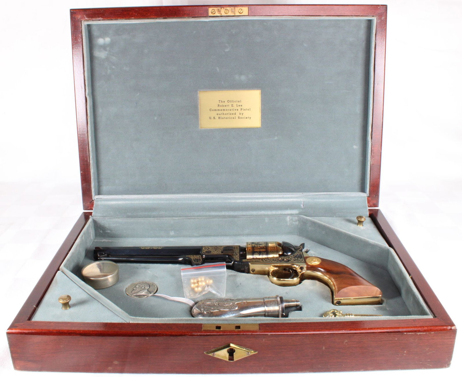 Robert E. Lee Commemorative 1851 Navy Colt .36 Caliber Black Powder Revolver Set, Authorized by the: Robert E. Lee commemorative 1851 Navy Colt-style black powder revolver chambered in .36 caliber, authorized by the U.S. Historical Society. Features engraved finish with 24K gold accents, brass-plated