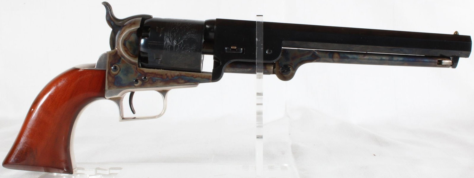 Colt Second Generation 1851 Navy .36 Caliber Black Powder Revolver, S/N 14869, w/ Original Box: Colt Second Generation 1851 Navy black powder revolver chambered in .36 caliber. Features blued and color case hardened finish with octagonal barrel, brass trigger guard, and walnut grips. Includes or