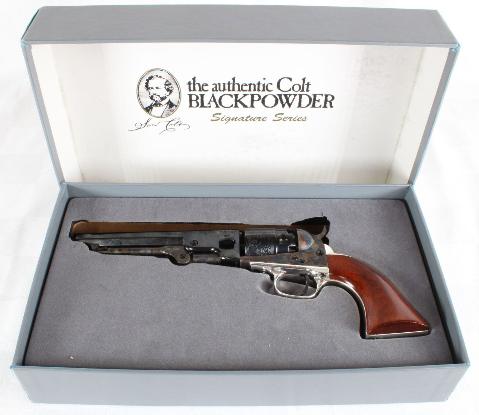 Colt Signature Series 1862 Pocket Navy .36 Caliber Black Powder Revolver, 5.5" Octagonal Barrel, S/N: Colt Signature Series 1862 Pocket Navy black powder revolver chambered in .36 caliber. Features 5.5" octagonal barrel, blued and color case hardened finish, brass trigger guard, and walnut grips. Incl