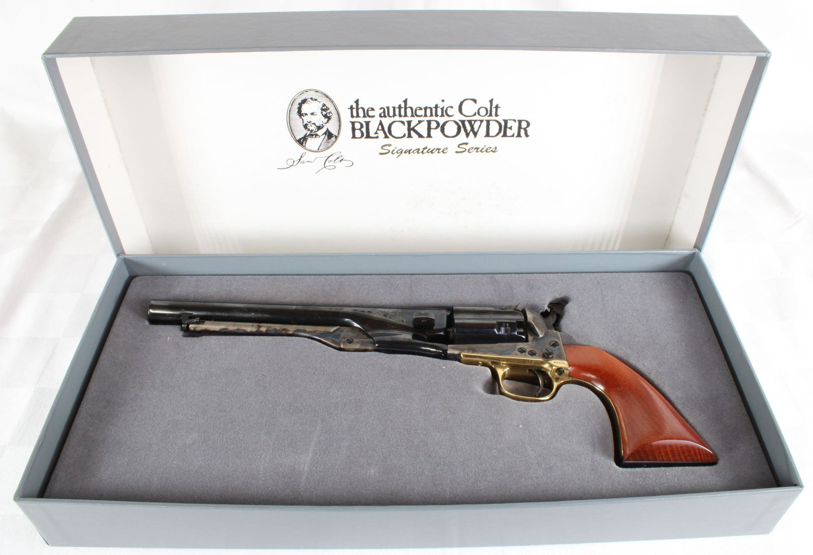 Colt Signature Series 1860 Army Fluted Cylinder .44 Caliber Black Powder Revolver, S/N 220667, w/: Colt Signature Series 1860 Army black powder revolver chambered in .44 caliber. Features fluted cylinder, blued and color case hardened finish, brass trigger guard, and walnut grips. Includes original