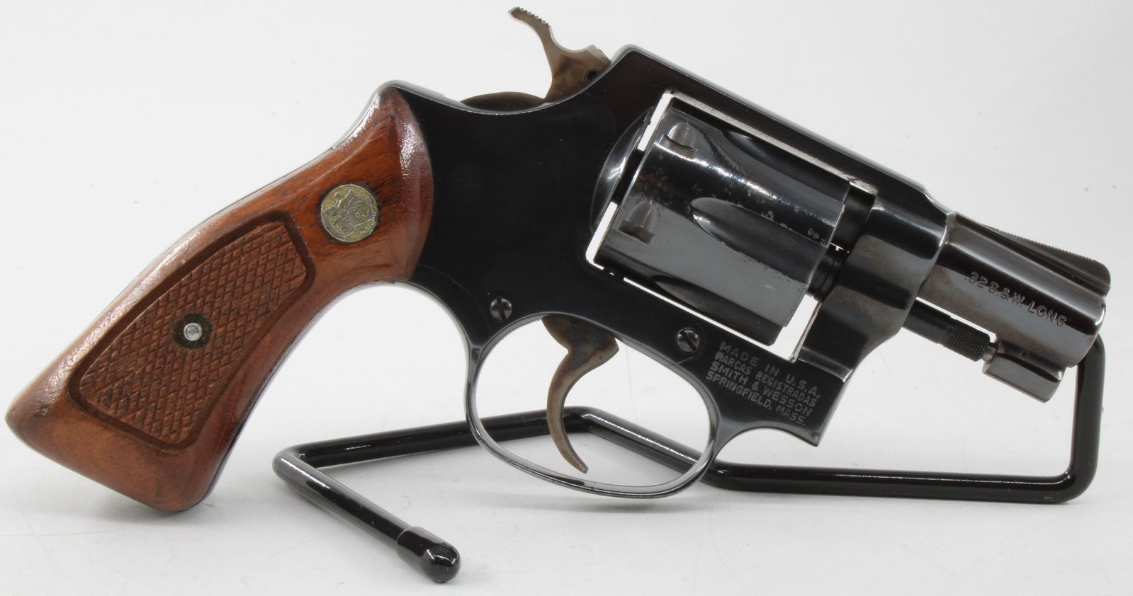 Smith & Wesson Model 31-1 .32 S&W Long Double Action Revolver: Smith & Wesson Model 31-1 double-action revolver chambered in .32 S&W Long with 2-inch barrel and 6-shot cylinder. Built on the J-frame with blued finish, exposed hammer, fixed sights, and checkered w