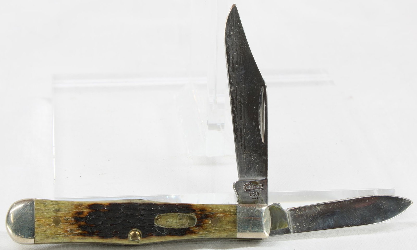 Case Folding Pocket Knife - 2 Blade: Case folding pocket knife featuring two blades, jigged bone handles, oval CASE shield, and nickel silver bolsters. Tang stamped "CASE USA." Knife shows light to moderate handling wear with minor blade
