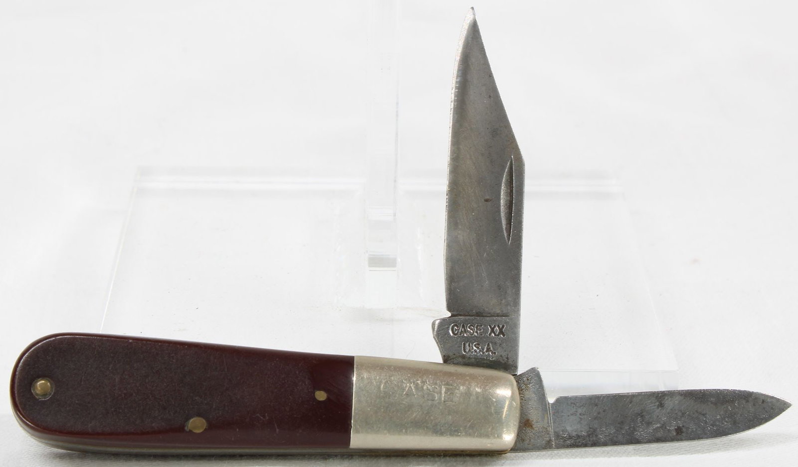 Case Folding Pocket Knife- 2 Blade: Case XX USA folding pocket knife featuring two blades with smooth burgundy synthetic handles, engraved CASE front bolster, and brass liners. Knife shows moderate handling wear with minor oxidation, sc