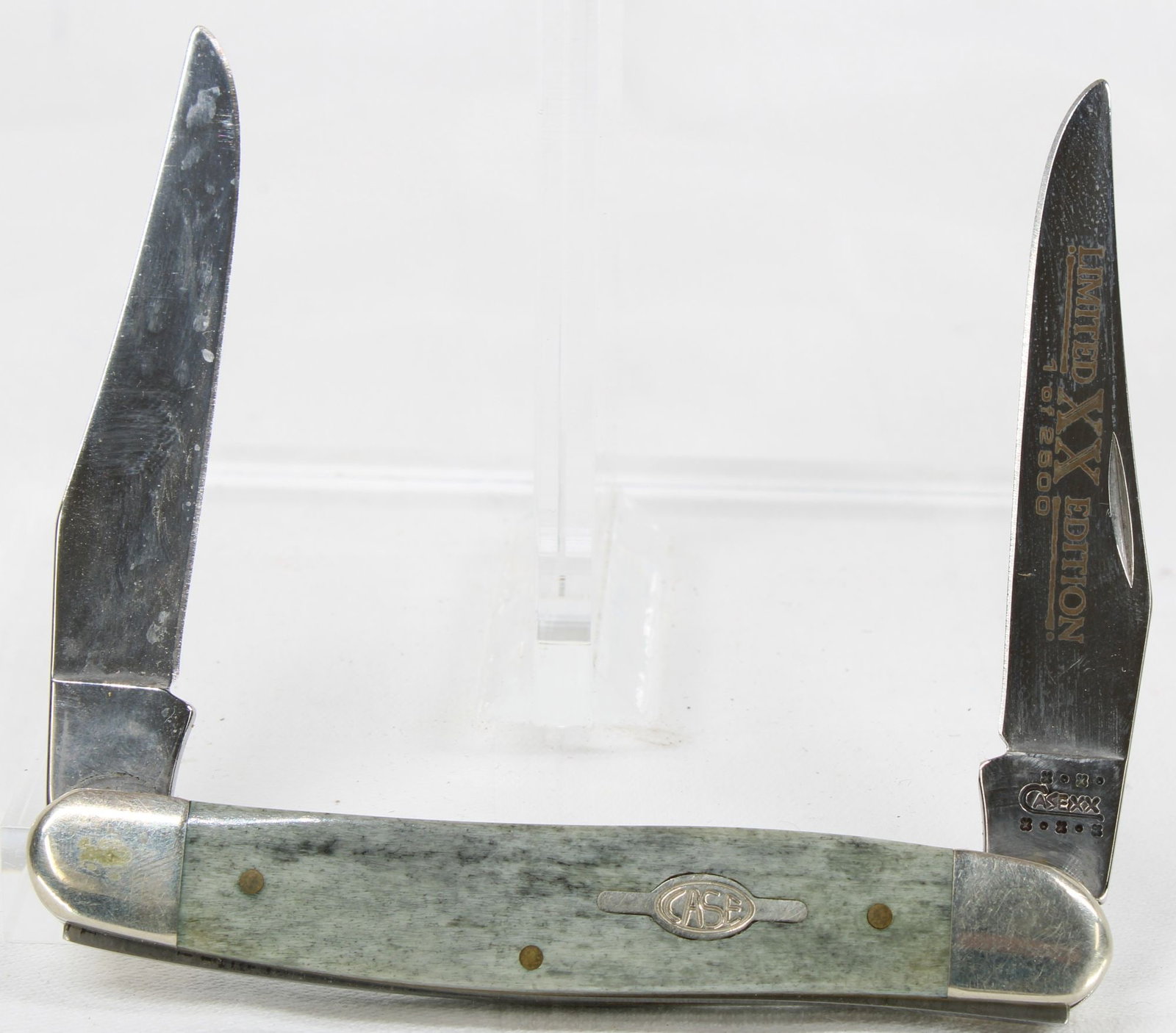 Case XX Limited Edition Folding Pocket Knife - 2 Blade, 1 of 2500: Case XX limited edition folding pocket knife featuring two blades with green-gray smooth handles, Case bomb shield, and nickel silver bolsters. Secondary blade etched "Limited XX Edition 1 of 2500." K