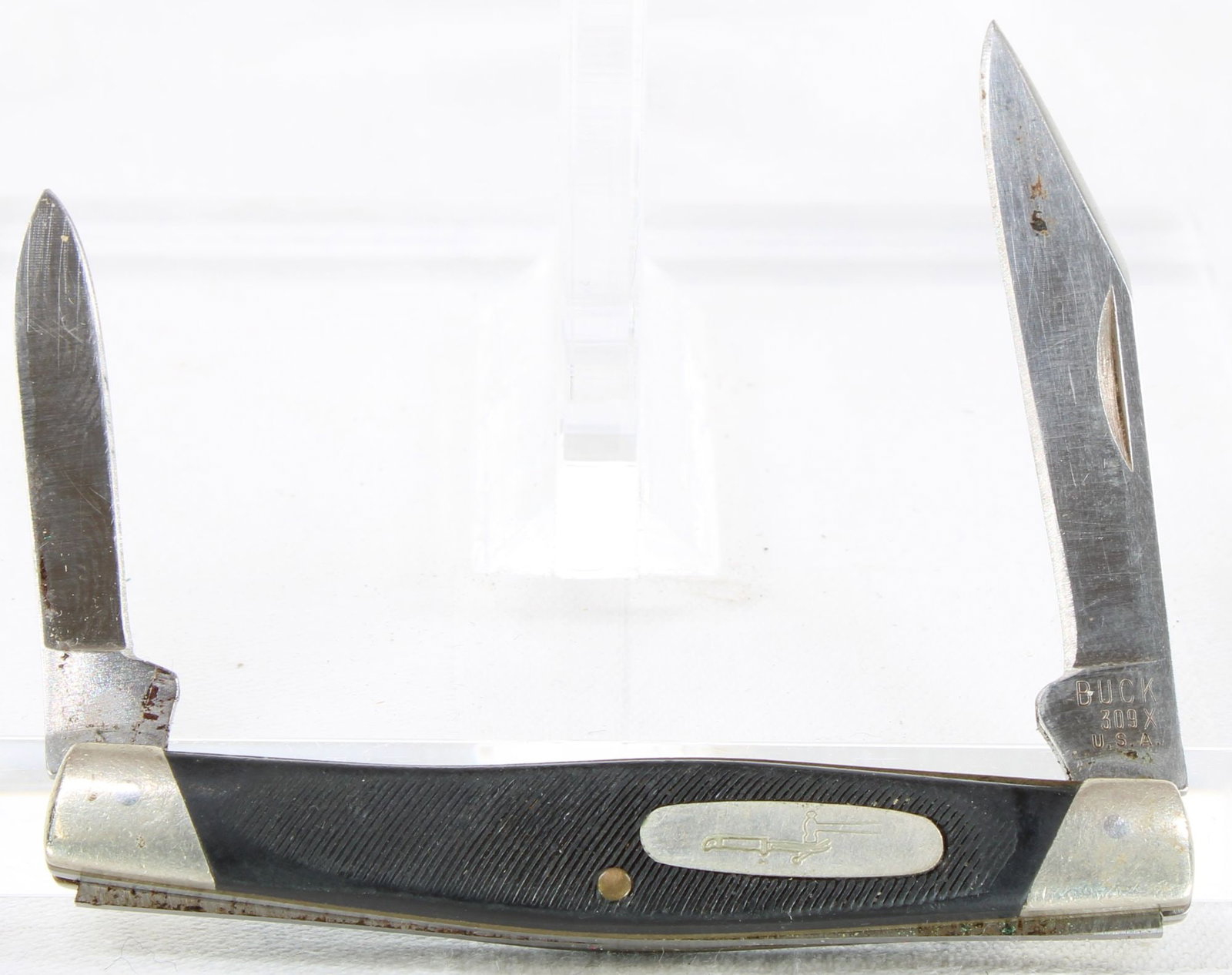 Buck Model 309 Folding Pocket Knife - 2 Blade: Buck Model 309 folding pocket knife featuring two blades, black synthetic handles, Buck shield, and nickel silver bolsters. Knife shows light to moderate handling wear with minor oxidation and spottin